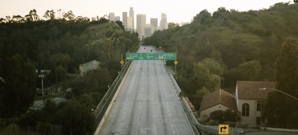 a highway with a city in the background